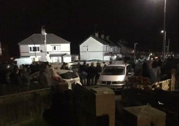 Crowds gather at the roof-top stand-off in Seaham.