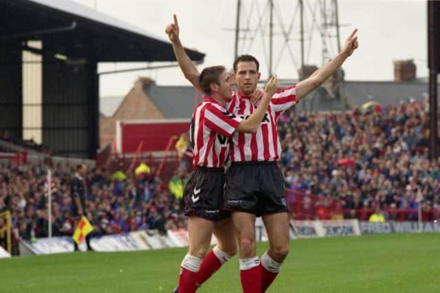 Lee Howey, arms outstretched, celebrates a goal for Sunderland.