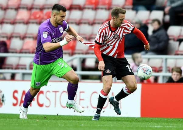 Bristol City defender Bailey Wright tracks Aiden McGeady in their 2-1 win at the Stadium of Light in October. The sides meet again on Saturday. Picture by Frank Reid