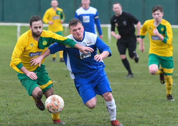 Leam Rangers (yellow) scrap it out with Hartlepool in last week's Durham County Trophy semi-final win. Picture by Kevin Brady