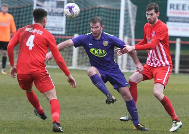 Ryhope CW (purple) battle for the ball against Seaham Red Star last week. Picture by Kevin Brady