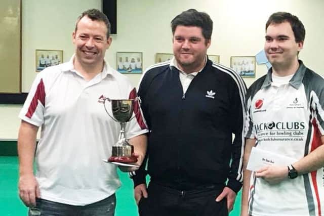 David Bolt (left) receives his prize after winning the Open Singles Circuit title at Worksop.