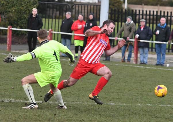 Ryhope CW striker Mickey Rae rounds the Guisborough Town keeper only to see the ball fly out out of play. Picture by Kevin Brady