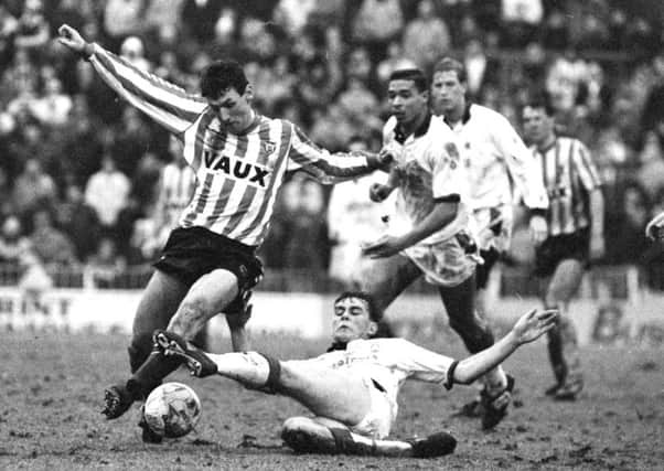 Sunderland striker Peter Davenport rides a challenge from Forest's Steve Chettle at Roker Park in 1991. Picture by Kevin Brady