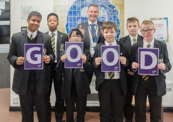St Aidan's students celebrate the good Ofsted report with headteacher Kevin Shepherd.