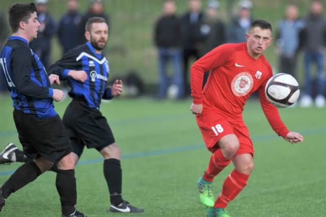 Durham Sunday Cup quarter-final action between Victoria Gardens (red) and Peterlee Catholic Club. Picture by Tim Richardson