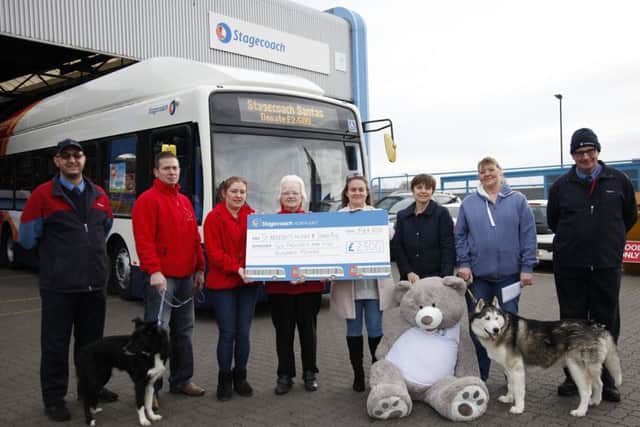 Stagecoach drivers have given a generous donation to St Benedict's Hospice and Stray Aid.