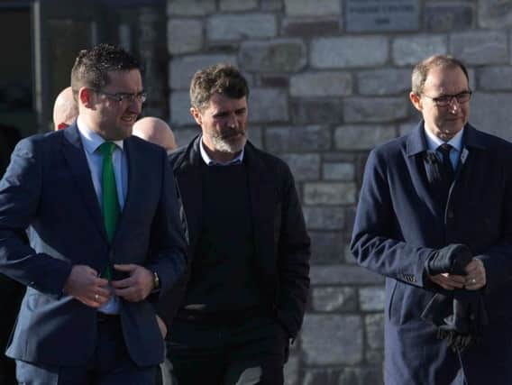 Roy Keane (centre) and Martin O'Neill (right) arrive for the funeral of former Celtic and Manchester United footballer Liam Miller, at St. John the Baptist Church in Ovens, County Cork. Picture by Clare Keogh/PA Wire