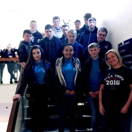 Joanne Moore-Senior from the Tall Ships Project Team visits the Port 300 exhibition with the sail trainees.