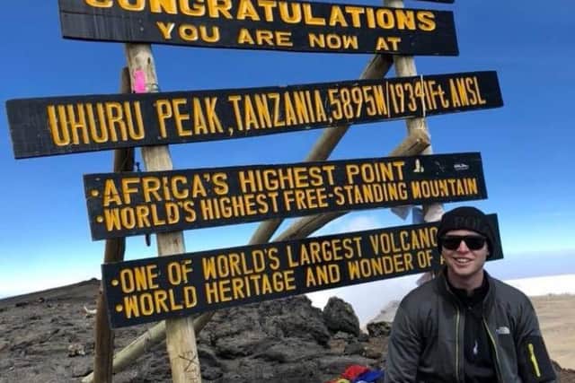 Connor Georgeson at the top of Mount Kilimanjaro