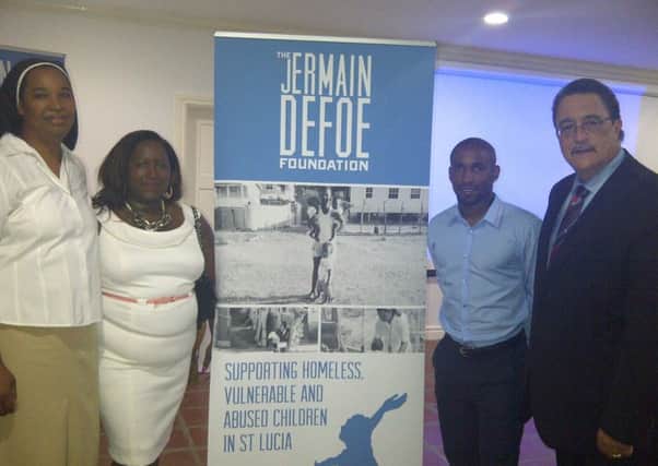 The Jermain Defoe Foundation was officially launched in 2013 in St Lucia. The photo shows from left Anthonia David from Holy Family Children's Home, Jermain's mum Sandra, Jermain andÂ then Prime Minister Dr Kenny Anthony.