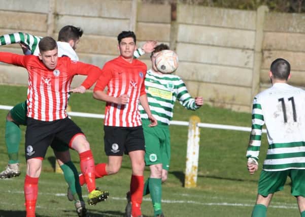 Silksworth CW (red/white) battle in vain against Cleator Moor Celtic last weekend. Picture by Kevin Brady