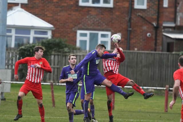 Ryhope CW (red/white) scrap it out with Guisborough Town in last week's 3-0 home defeat. Picture by Kevin Brady