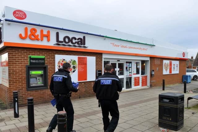 Officers on the scene of the armed robbery at J&H Local in Silksworth.