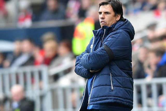 Chris Coleman watches on.