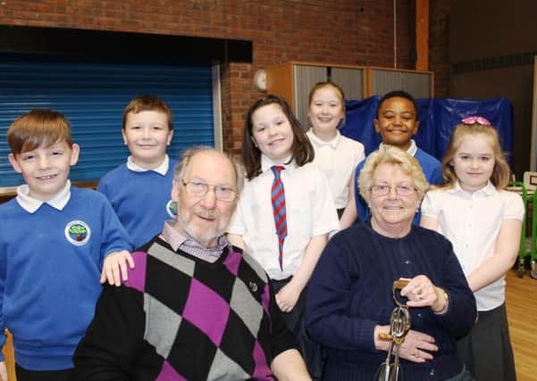Ron and Pat Forsyth with pupils who took part in the dementia
cafÃ© launch.