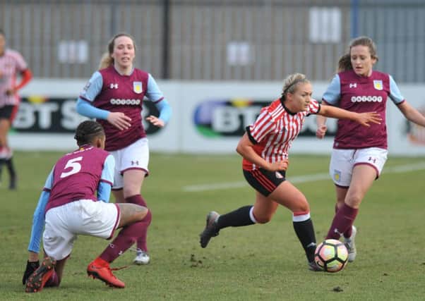 Bridget Galloway tries to find a way through the Aston Villa defence.