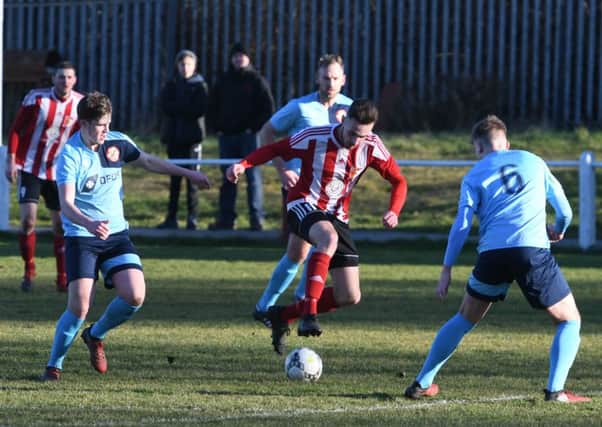 Sunderland RCA's Stephen Callen (red/white) attacks North Shields at Meadow Park on Saturday. Picture by Kevin Brady