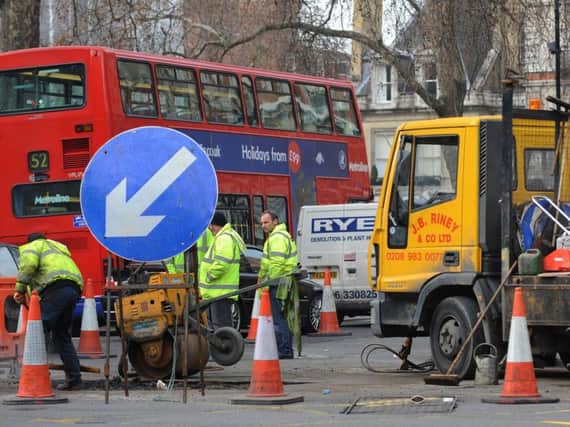 Charges for utility companies digging up roads will be rolled out across England to reduce congestion.