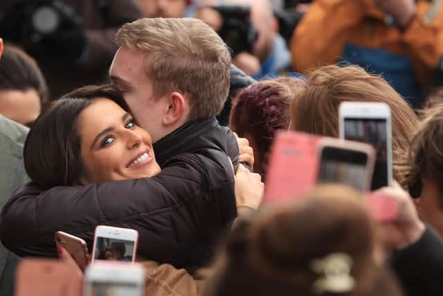 Cheryl has a hug with a fan after opening the new Prince's Trust and Cheryl's Trust centre in Newcastle. Pic: PA.