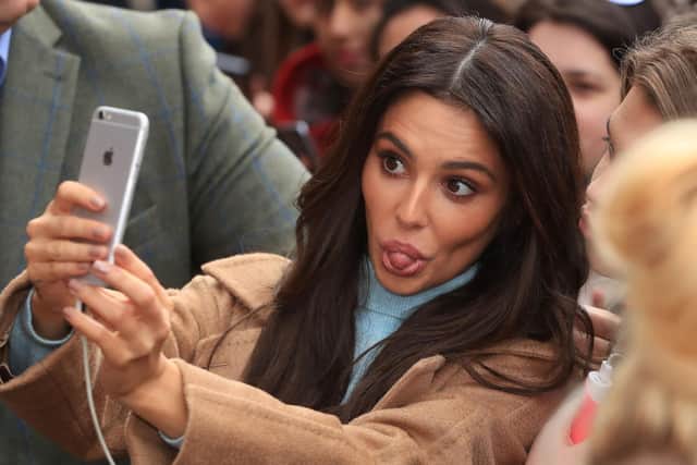 Cheryl has a selfie with fans after opening the new Prince's Trust and Cheryl's Trust centre in Newcastle. Pic: PA.