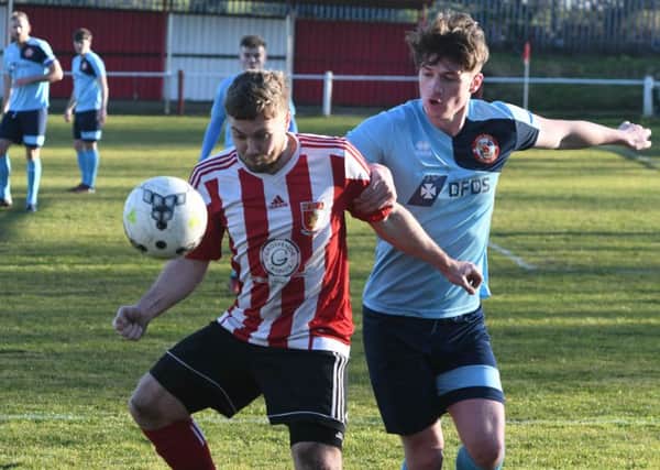 Sunderland RCA's Michael Charlton (red/white) comes under pressure from North Shields last week. Picture by Kevin Brady