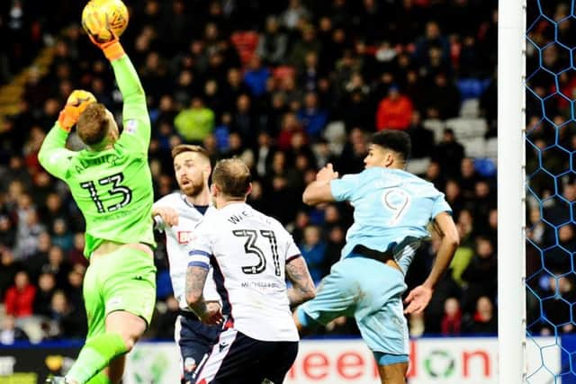Bolton boss Ben Alnwick deals with an off-target cross meant for striker Ashley Fletcher. Picture by Frank Reid