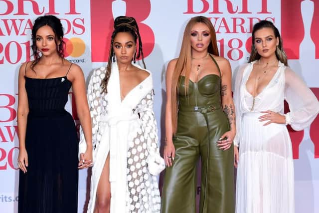 Little Mix's Perrie Edwards, Jesy Nelson, Leigh-Anne Pinnock and Jade Thirlwall attending the Brit Awards at the O2 Arena, London. Photo credit: Ian West/PA Wire