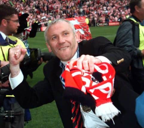 Sunderland manager Peter Reid raise a jubilant fist into the air  today Sunday, 9th May 1999, after the presentation of the Division One trophy,final score Sunderland beat Birmingham 2-1. PA Photo by Paul Barker/PA