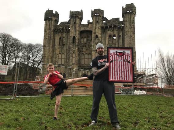 Bradley Brown with his dad Ian at Hylton Castle, which will benefit from the fundraising.