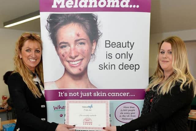 From left, Gillian Robson, from Tancream, is presented with her certificate by Kerry Rafferty.
