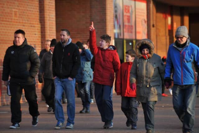 Sunderland fans leave the Stadium of Light, having seen their team twice come from behind to claim a point