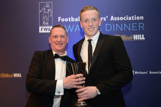 Colin Young, secretary of the North East Football Writers Association, presenting Jordan Pickford with his award.