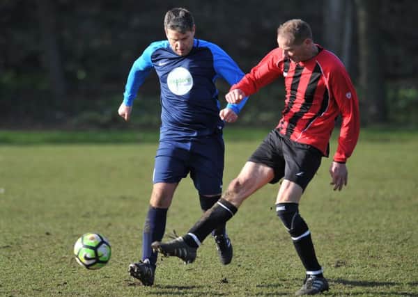 Over-40s action as Wearmouth CW (blue) take on Spennymoor Town last week. Picture by Tim Richardson