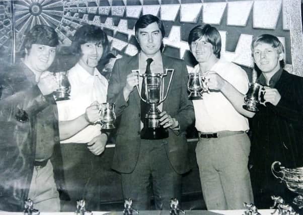 Farringdon bowlers including Vic Avery, second left, and Frankie Adams, second right. The occasion is the Vaux Gold Tankard Competition.