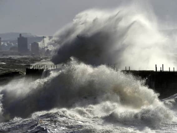 Huge North Sea waves crash against the Heugh Breakwater at the Headland, Hartlepool.  Pic by Tom Collins
