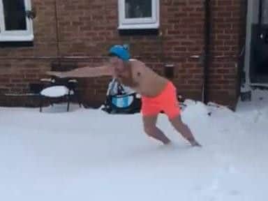 Thomas Armbruster dives into the snow this morning.
