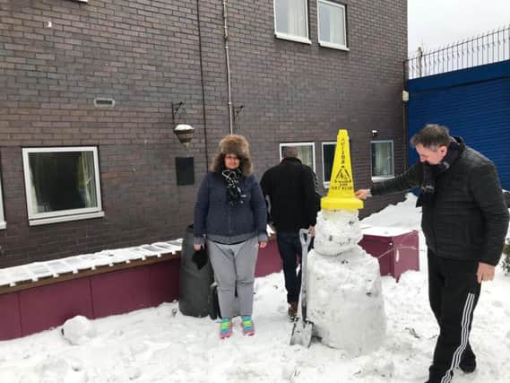 Residents of Swan Lodge built a snowman as they took shelter in its accommodation.