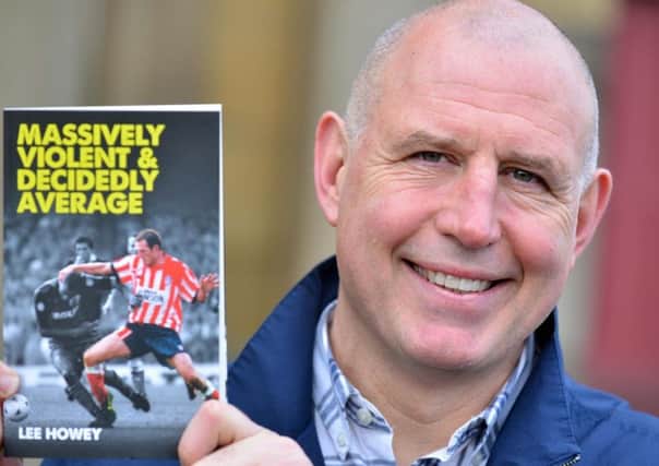 Former Sunderland footballer Lee Howey with a copy of his new book.