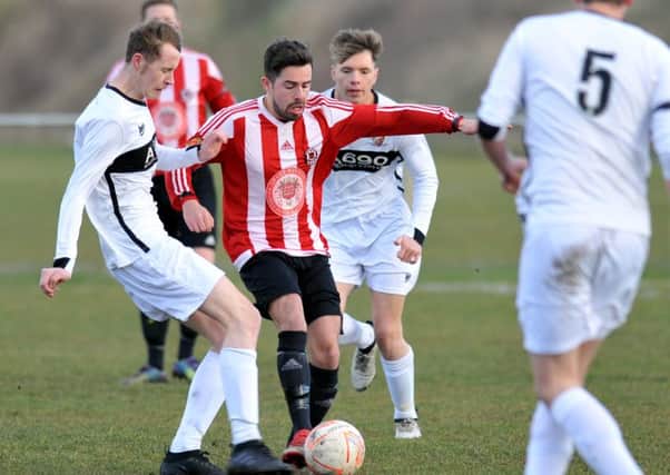 Sunderland West End (red/white) take on lowly Coxhoe Athletic last month. Picture by Tim Richardson