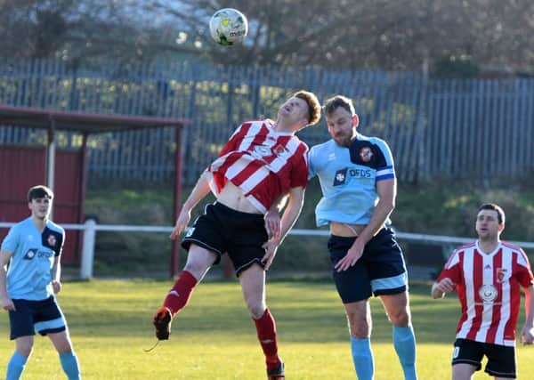 Sunderland RCA's Luke Page (red/white) rises to win a header against North Shields last month.