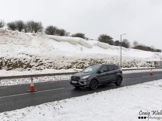 This photo by Craig Wallace shows the snow overhanging on the stretch of the A690.