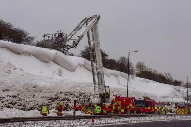 Tyne and Wear Fire and Rescue Service working to try and knock down some of the overhanging snow yesterday.