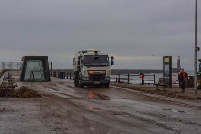Council workers begin the clean-up operation at Roker Pier.