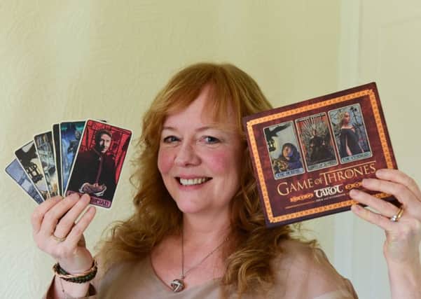 Author Liz Dean and her tarot cards produced in conjunction with Game of Thrones.