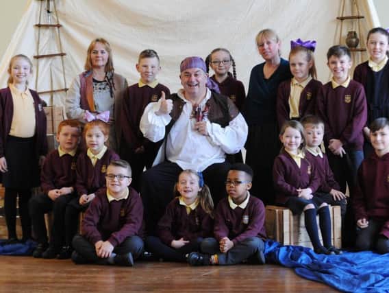 Children from St Anne's RC Primary School, Sunderland, watching a performance based on the history of the River Wear  in preparation for the arrival of the Tall Ships.