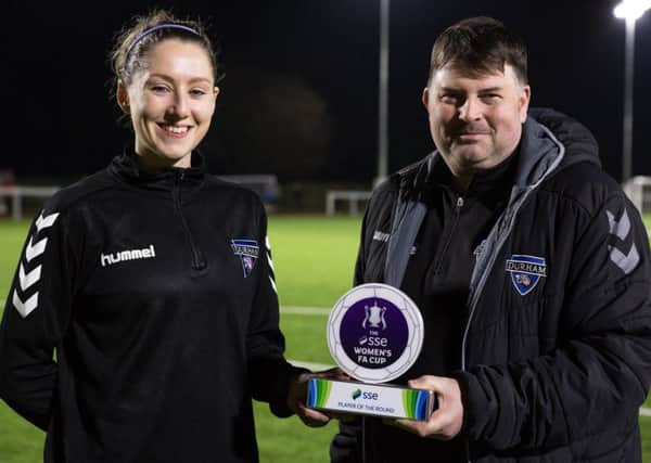 Durham Wildcats' Abi Cottam receives her SSE Women's FA Cup player of the round award from manager Lee Sanders