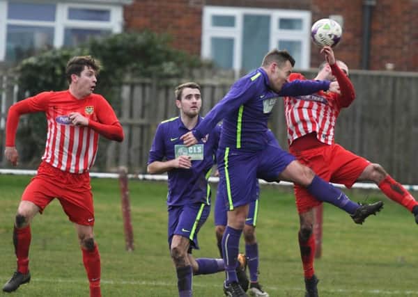 Ryhope CW (red/white) take on Guisborough Town in Division One last month.