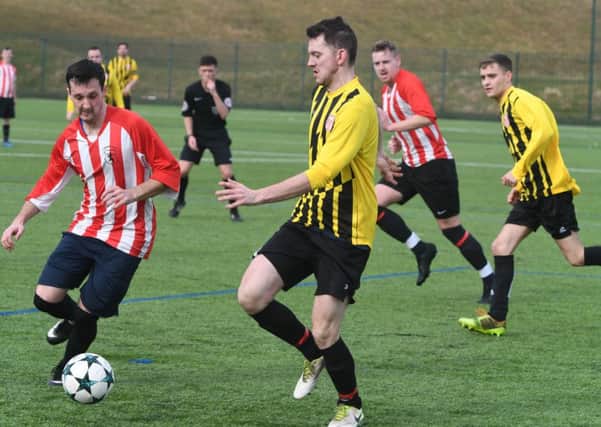 Lakeside SSC (red/white) take on Millfield Free Gardeners in the Sunderland Sunday League yesterday. Picture by Kevin Brady.