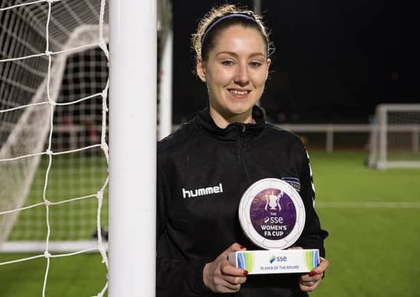 Durham Women's forward Abi Cottam with her SSE Women's FA Cup player of the round award.